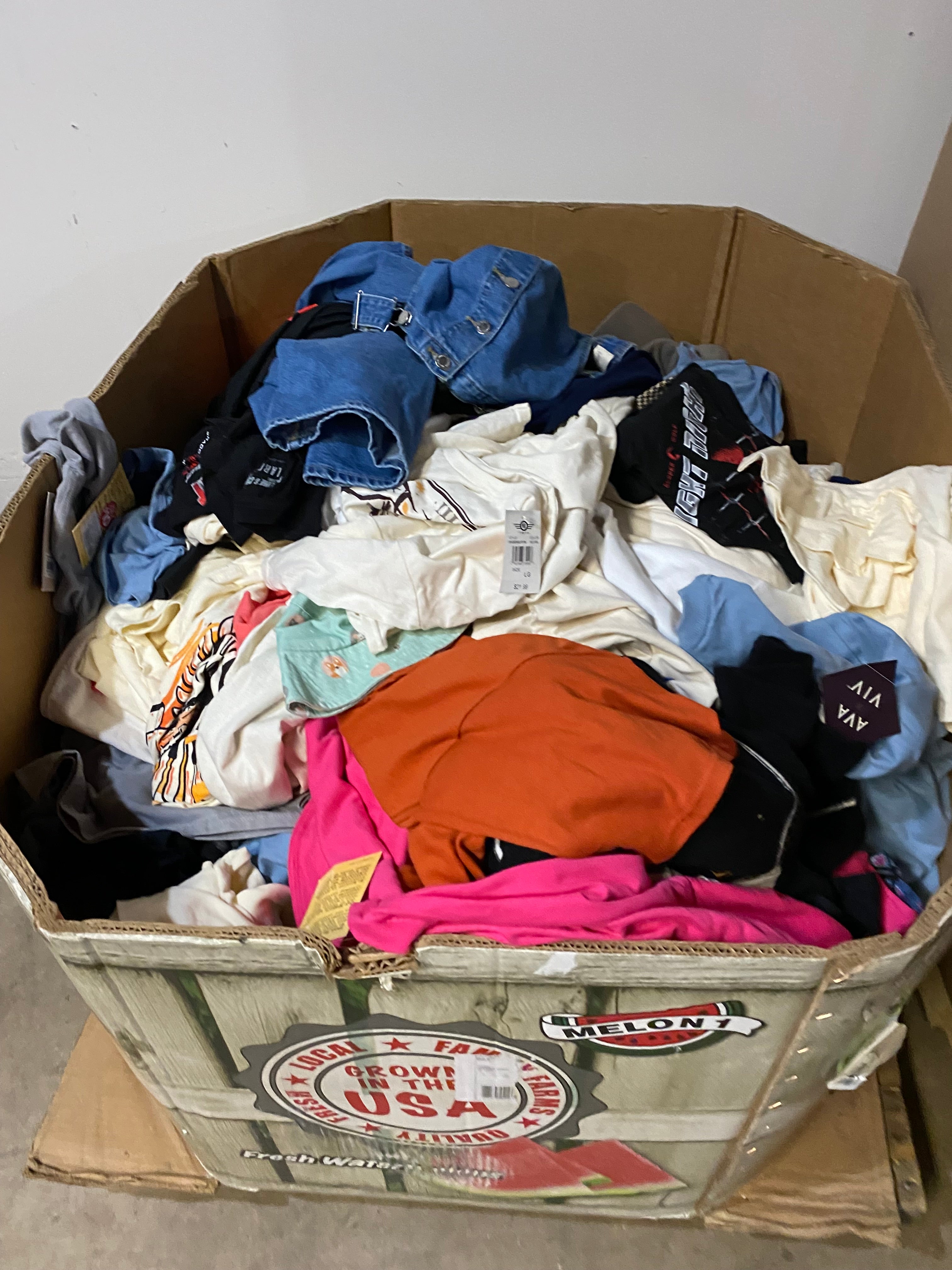 Watermelon gaylord box filled with assorted clothing and apparel bundles ideal for Whatnot sellers, resellers, and liquidation buyers